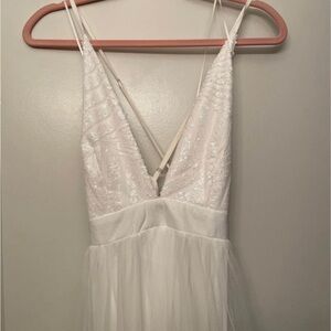 NWT Luxxel white formal dress with sequins and two high thigh slits. Size medium